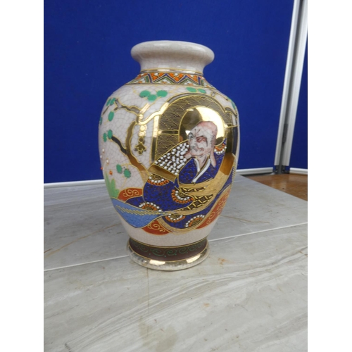 894 - An oriental style vase with hand painted detail.