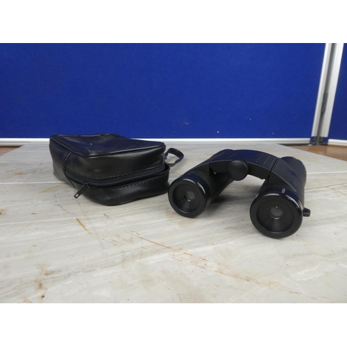 899 - A pair of Source binocular and case.