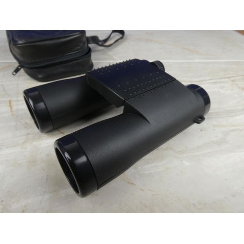 899 - A pair of Source binocular and case.