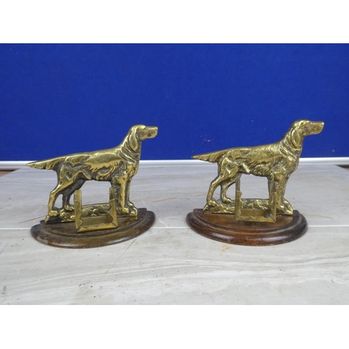 906 - A pair of brass dog ornaments with matchbox holders.