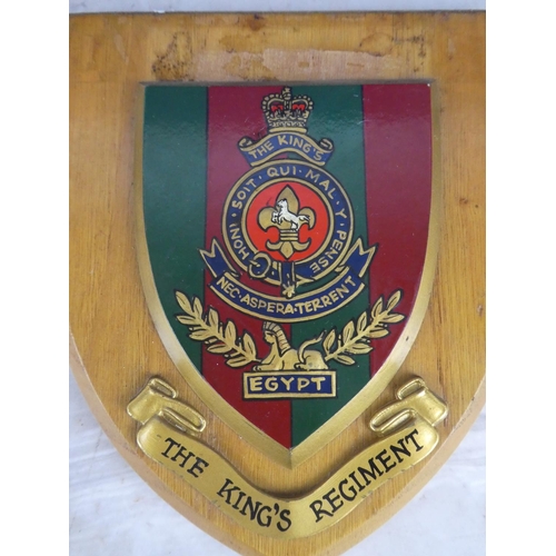 924 - A wooden shield wall plaque 'The King's Regiment'.17cm.