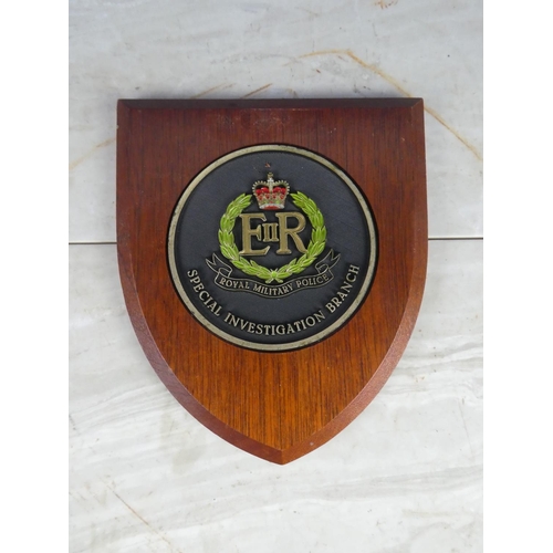 925 - A wooden shield wall plaque 'Royal Military Police - Special Investigation Branch'. approx 21cm.