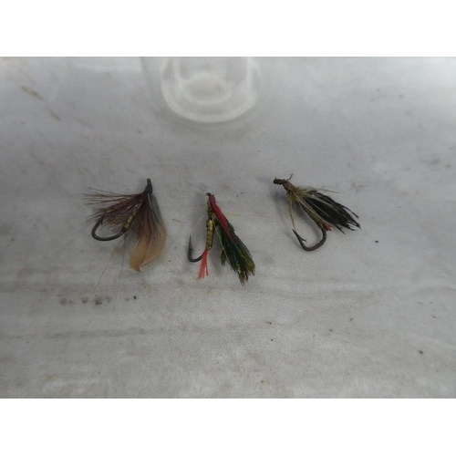 934 - Three fishing flies.