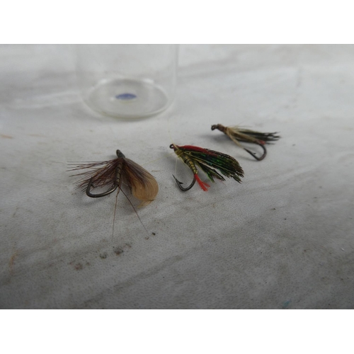 934 - Three fishing flies.