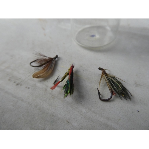 934 - Three fishing flies.