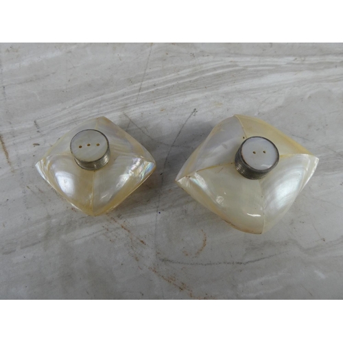 945 - A pair of vintage mother of pearl salt and pepper shakers.