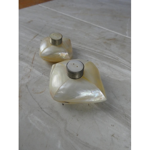 945 - A pair of vintage mother of pearl salt and pepper shakers.