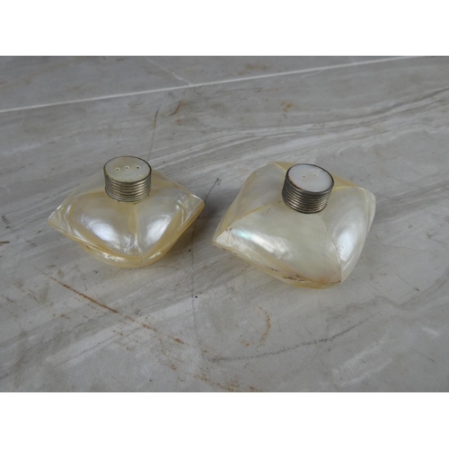 945 - A pair of vintage mother of pearl salt and pepper shakers.