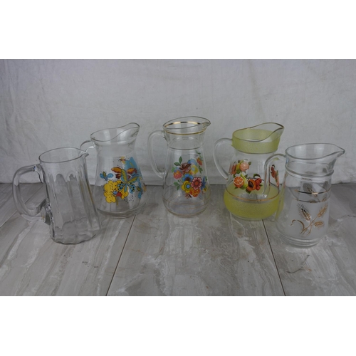 1018 - A collection of vintage water jugs.