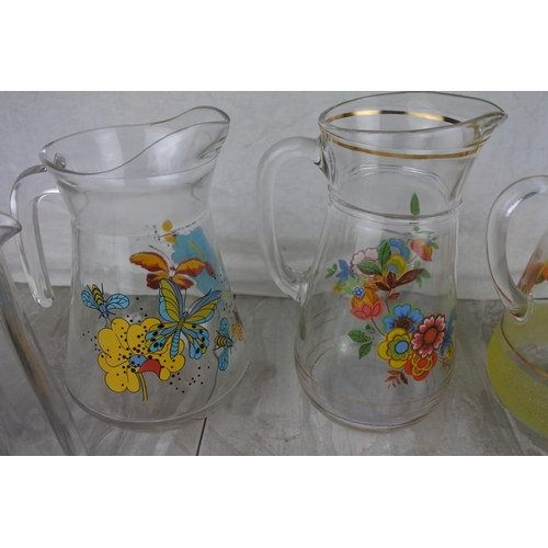 1018 - A collection of vintage water jugs.