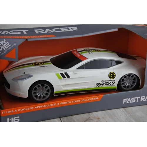 1027 - Two boxed Fast Racer toy cars scale 1:16.