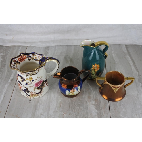 1042 - A Crown Devon pottery jug, a Mason's Ironstone pottery jug and two others.