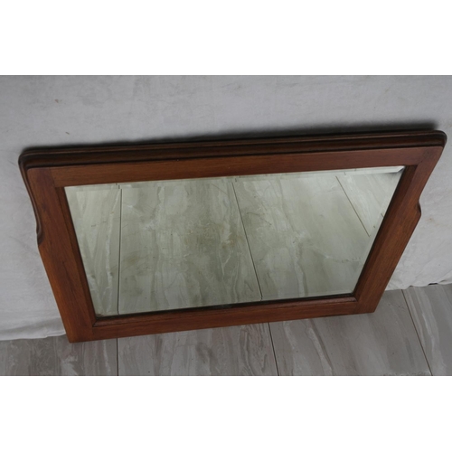 1049 - An oak framed wall mirror. approx 45x58cm.