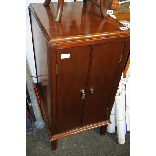 967 - A mahogany two door storage cupboard. approx 84x41x50cm.