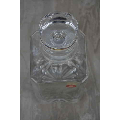 988 - An Enniskillen Crystal decanter with a etched figure of a golfer.