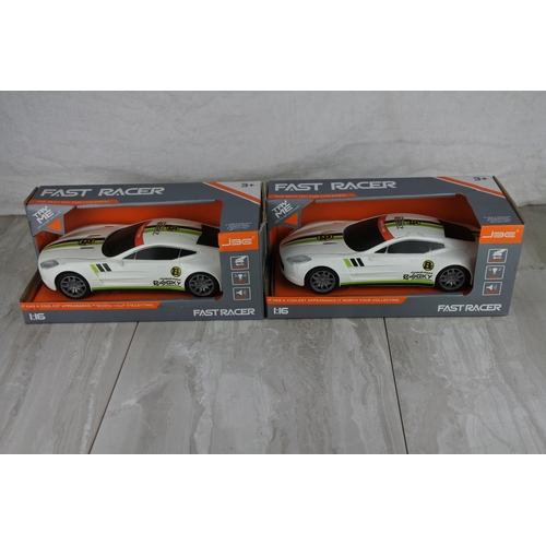 990 - Two boxed Fast Racer toy cars scale 1:16.