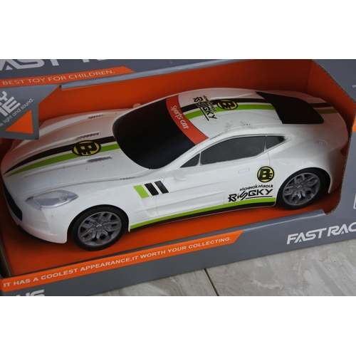 990 - Two boxed Fast Racer toy cars scale 1:16.