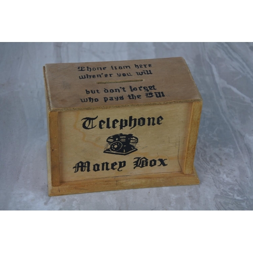 998 - A vintage telephone money box.