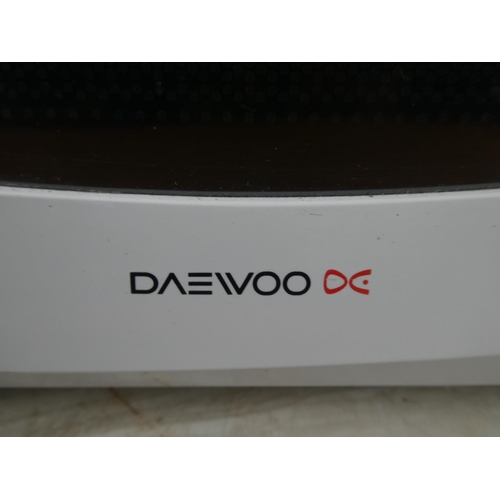 1054 - A small Daewoo microwave.