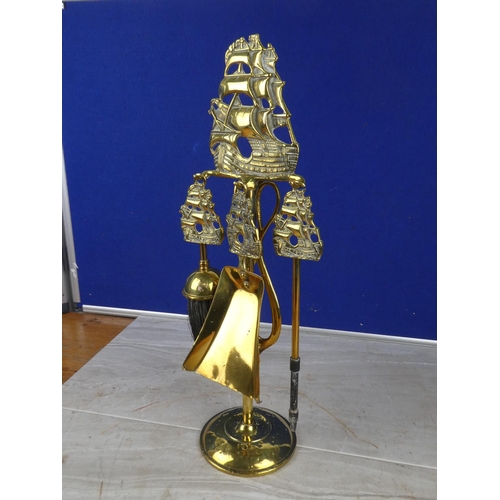 1055 - A stunning brass companion set with ship detail.