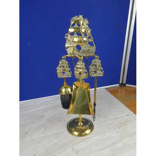 1055 - A stunning brass companion set with ship detail.