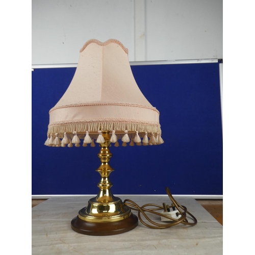 1063 - A brass based table lamp and shade. approx 50cm.