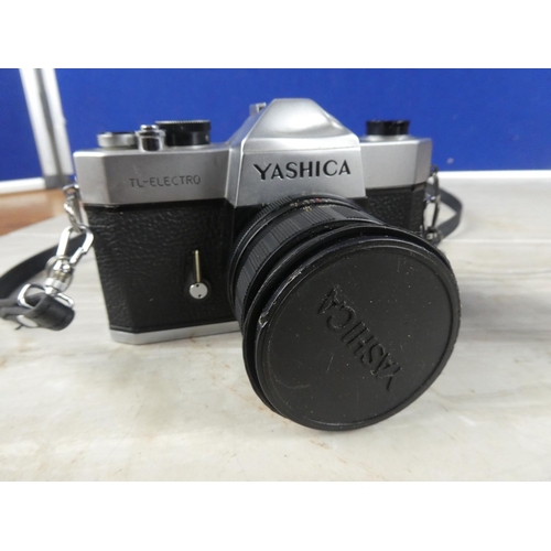 1086 - A vintage Yashica camera, a camera lens and more.