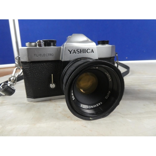 1086 - A vintage Yashica camera, a camera lens and more.