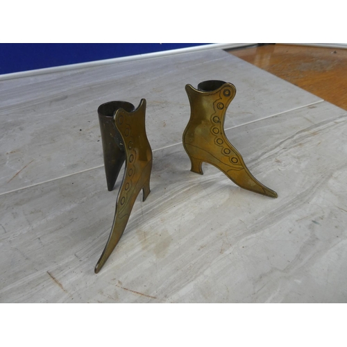 1110 - A pair of brass boot ornaments.