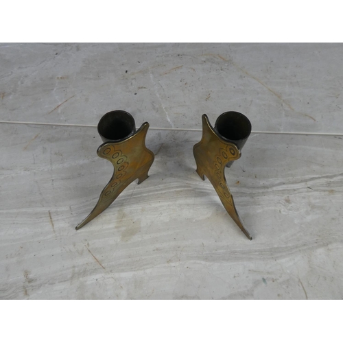 1110 - A pair of brass boot ornaments.