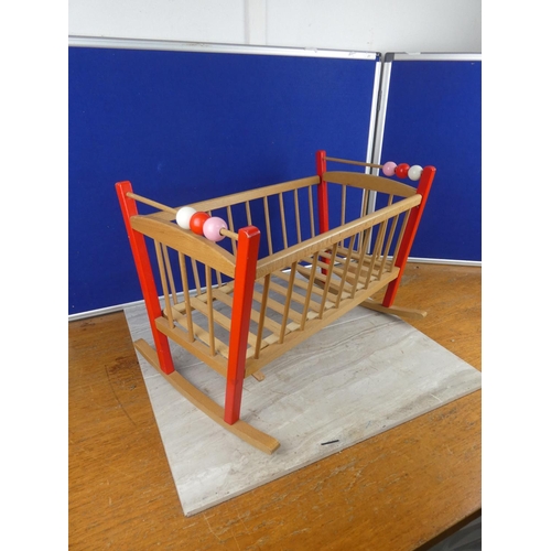 1116 - A wooden doll's cot. approx 36x53cm.