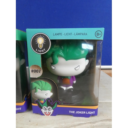 1128 - Three boxed 'The Joker' lights.