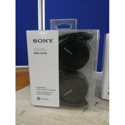 1143 - Three boxed Sony headphones.