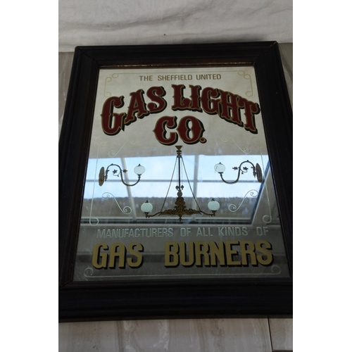 1151 - A framed Gas Light Co pub mirror. approx42x30cm.