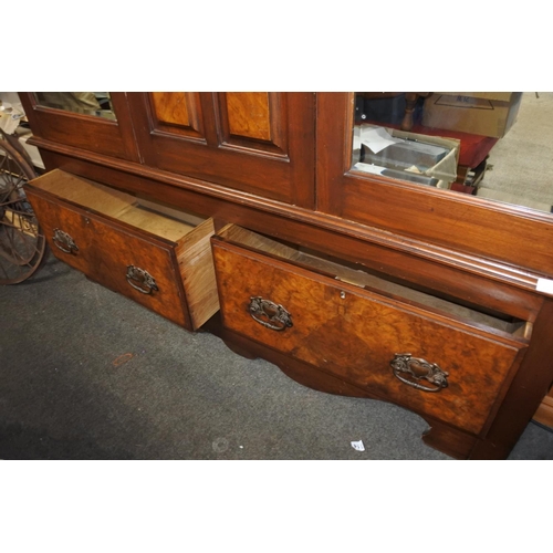 1152 - A stunning antique mahogany two door wardrobe with mirror doors. approx 215x150x48cm.