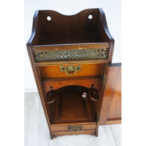 1178 - A stunning mahogany pipe storage cupboard with metal grill and two drawers. approx 50cm.