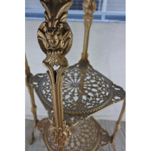 1180 - A three tier metal potstand. approx 72x26x26cm.