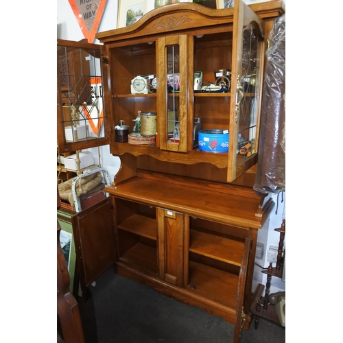 1190 - An oak dresser with leaded glass doors. approx 200x115x40cm.