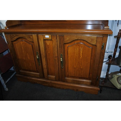 1190 - An oak dresser with leaded glass doors. approx 200x115x40cm.