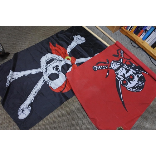 1219 - A pirate themed skull flag and pole.