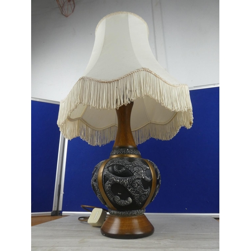 804 - A vintage pottery table lamp and shade. approx 67cm.