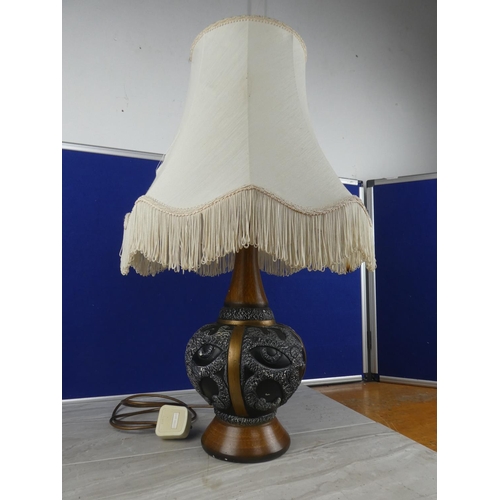 804 - A vintage pottery table lamp and shade. approx 67cm.