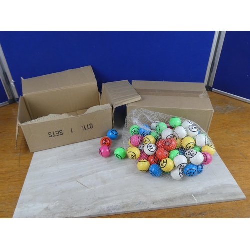 822 - Two boxes of bingo balls.