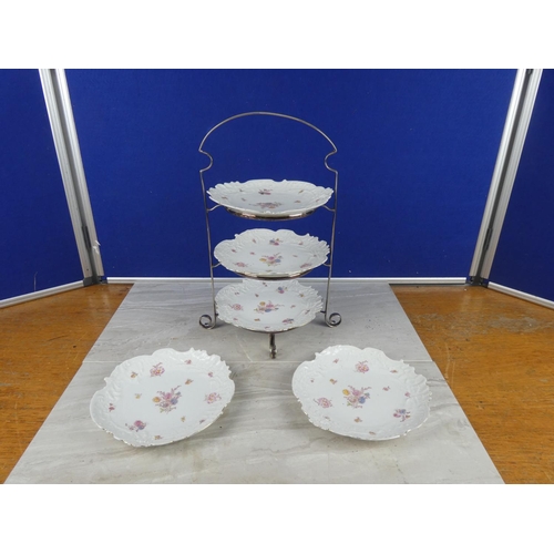 806 - A vintage three tier silver plated cake stand and two extra plates.