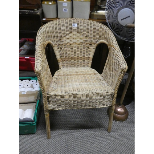 861 - A vintage rattan armchair.