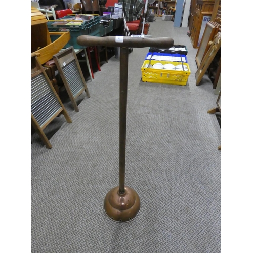 867 - An antique copper plunger. approx 83cm.