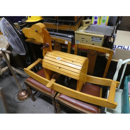 869 - A child's wooden rocking horse. approx 97x62cm.