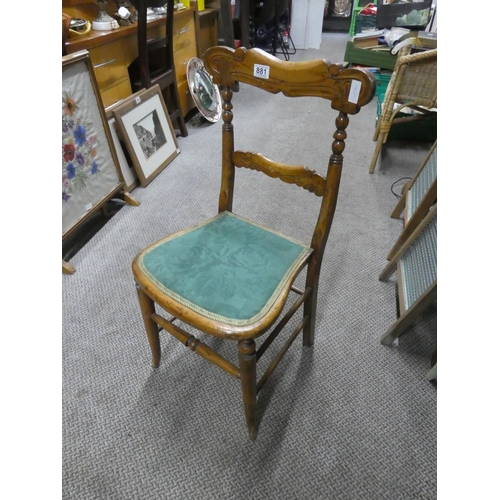 881 - An oak carved back bedroom chair.