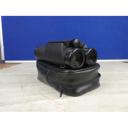 899 - A pair of Source binocular and case.