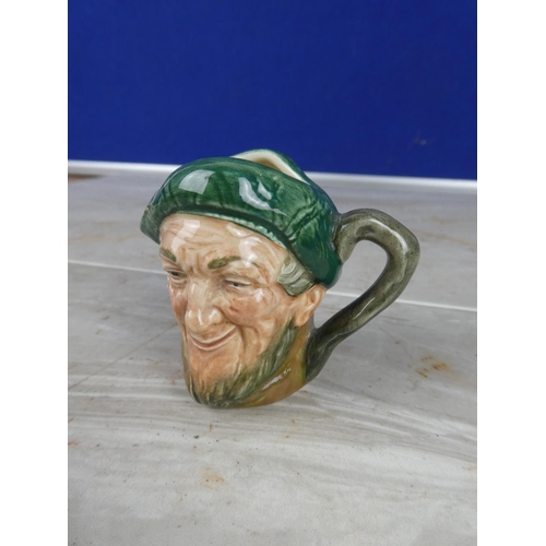 912 - A Royal Doulton mask jug.